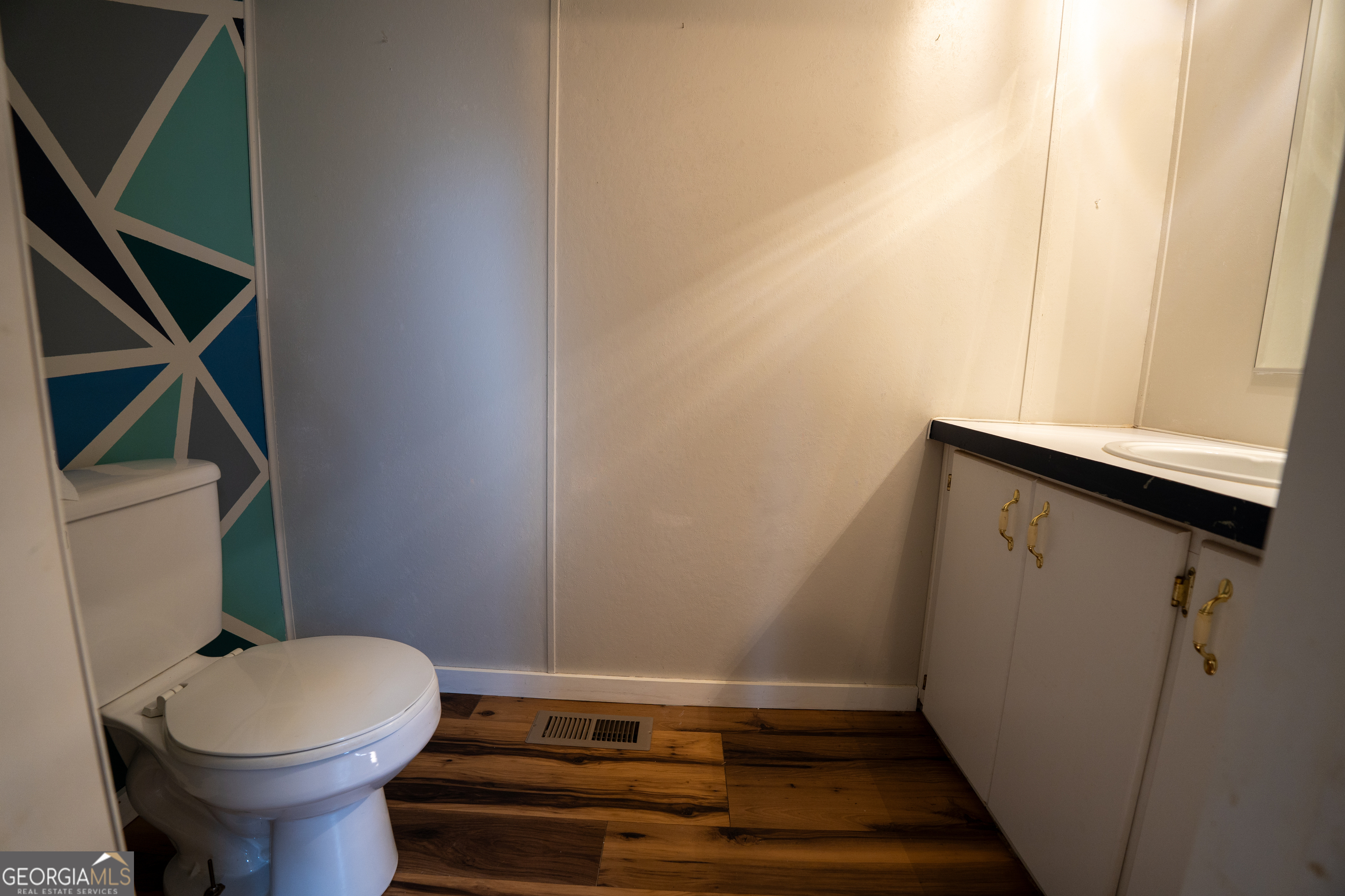 1100 Sapp Road Dry Branch, GA 31020 - Photo 25 of 54 a bathroom with a sink and a toilet