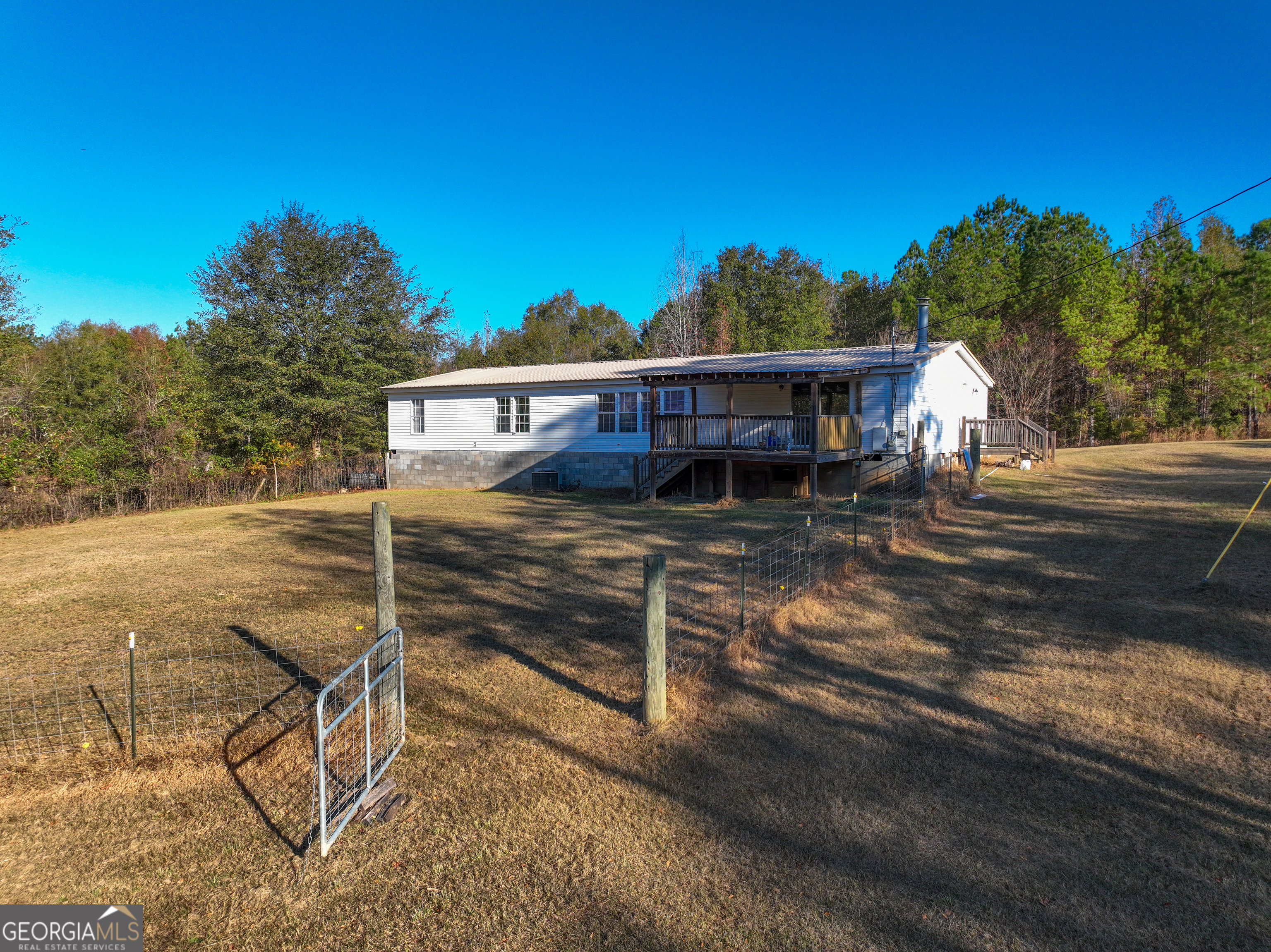 1100 Sapp Road Dry Branch, GA 31020 - Photo 27 of 54 a view of a house with backyard and sitting area
