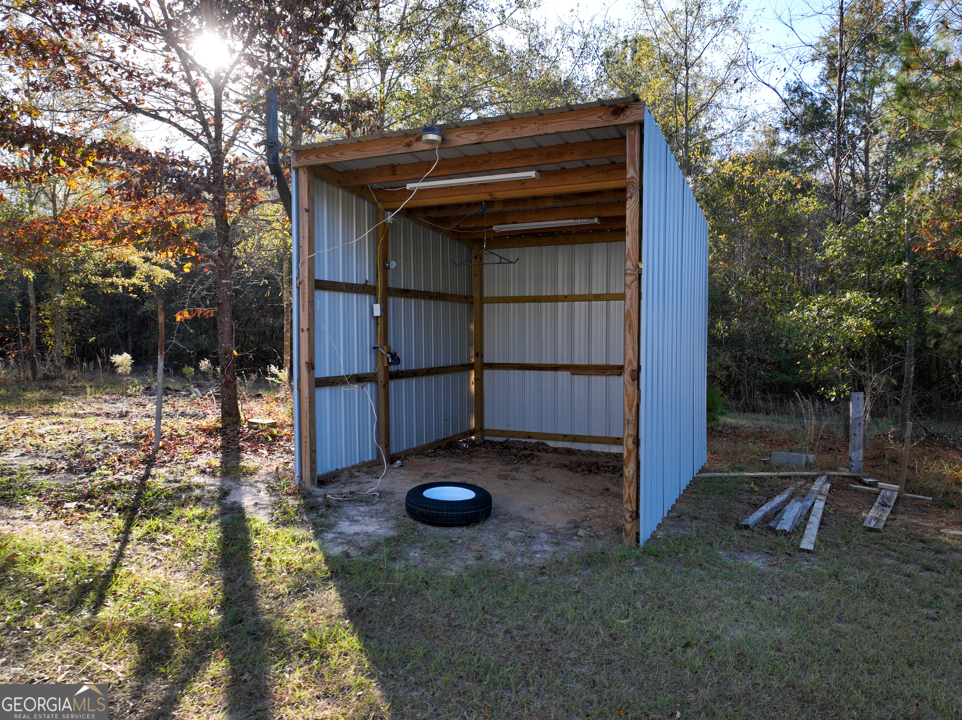 1100 Sapp Road Dry Branch, GA 31020 - Photo 30 of 54 a view of backyard with wooden fence and large trees