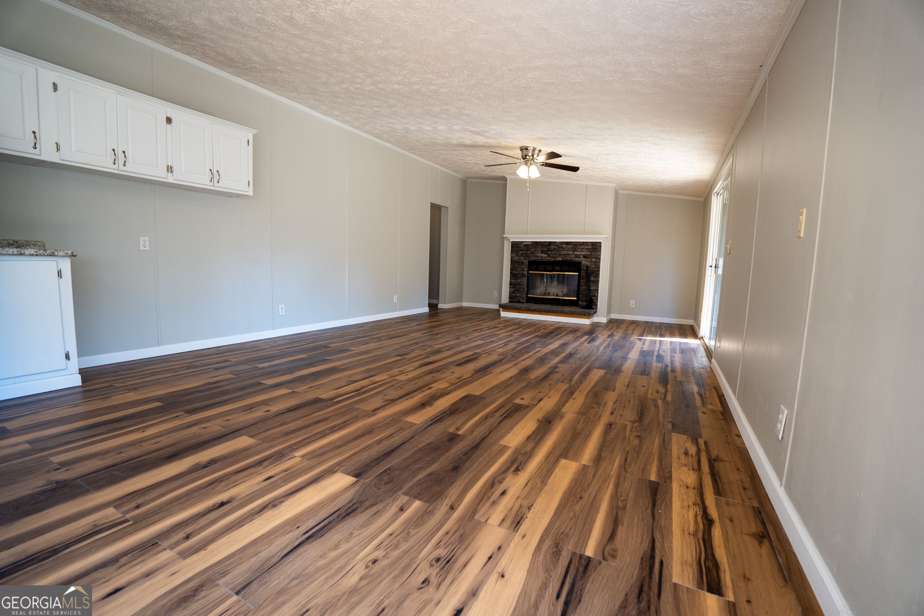 1100 Sapp Road Dry Branch, GA 31020 - Photo 4 of 54 a view of empty room with wooden floor