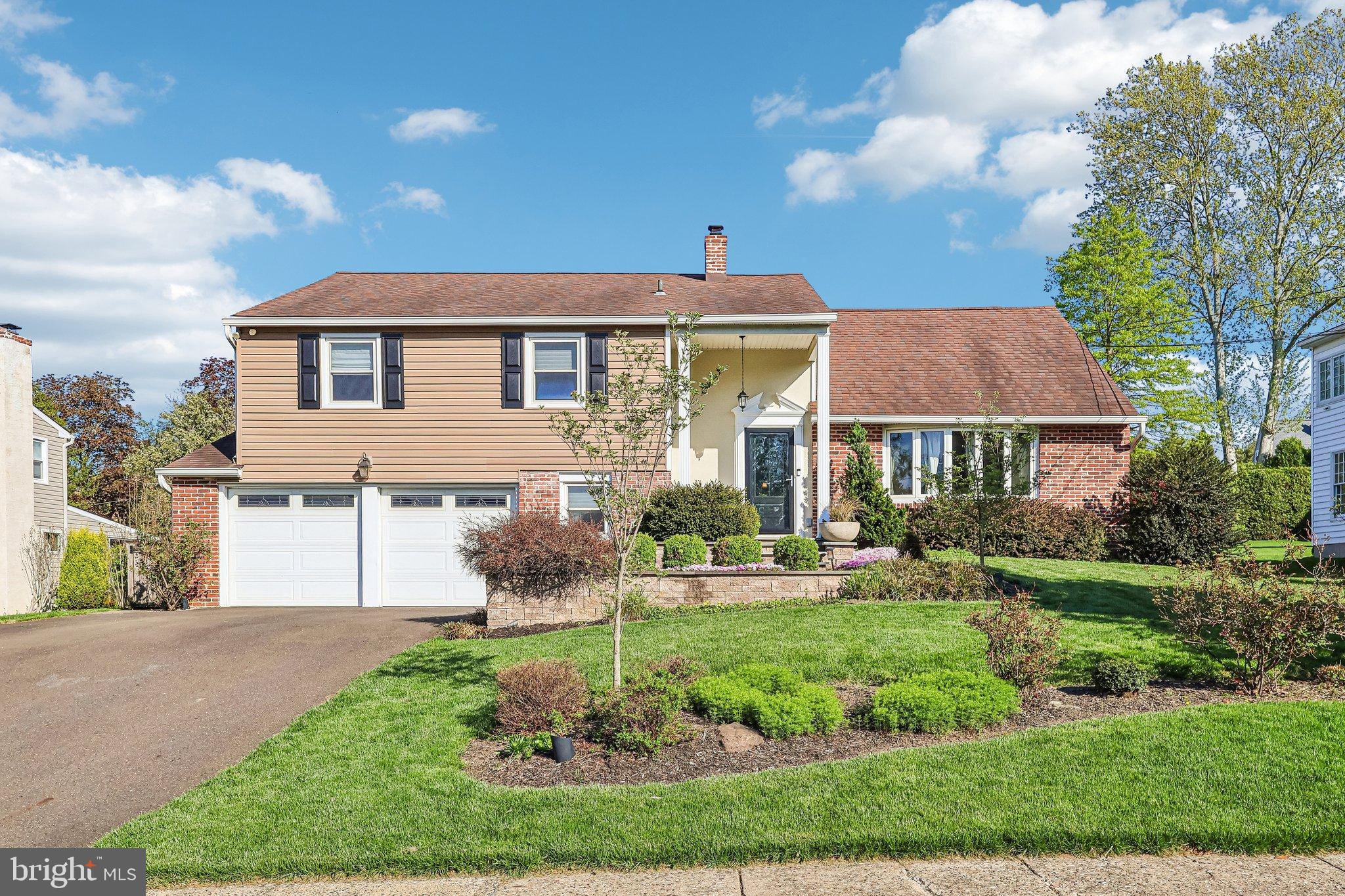 2291 Packard Avenue Huntingdon Valley, PA 19006 - Photo 1 of 38 a front view of a house with a yard and green space