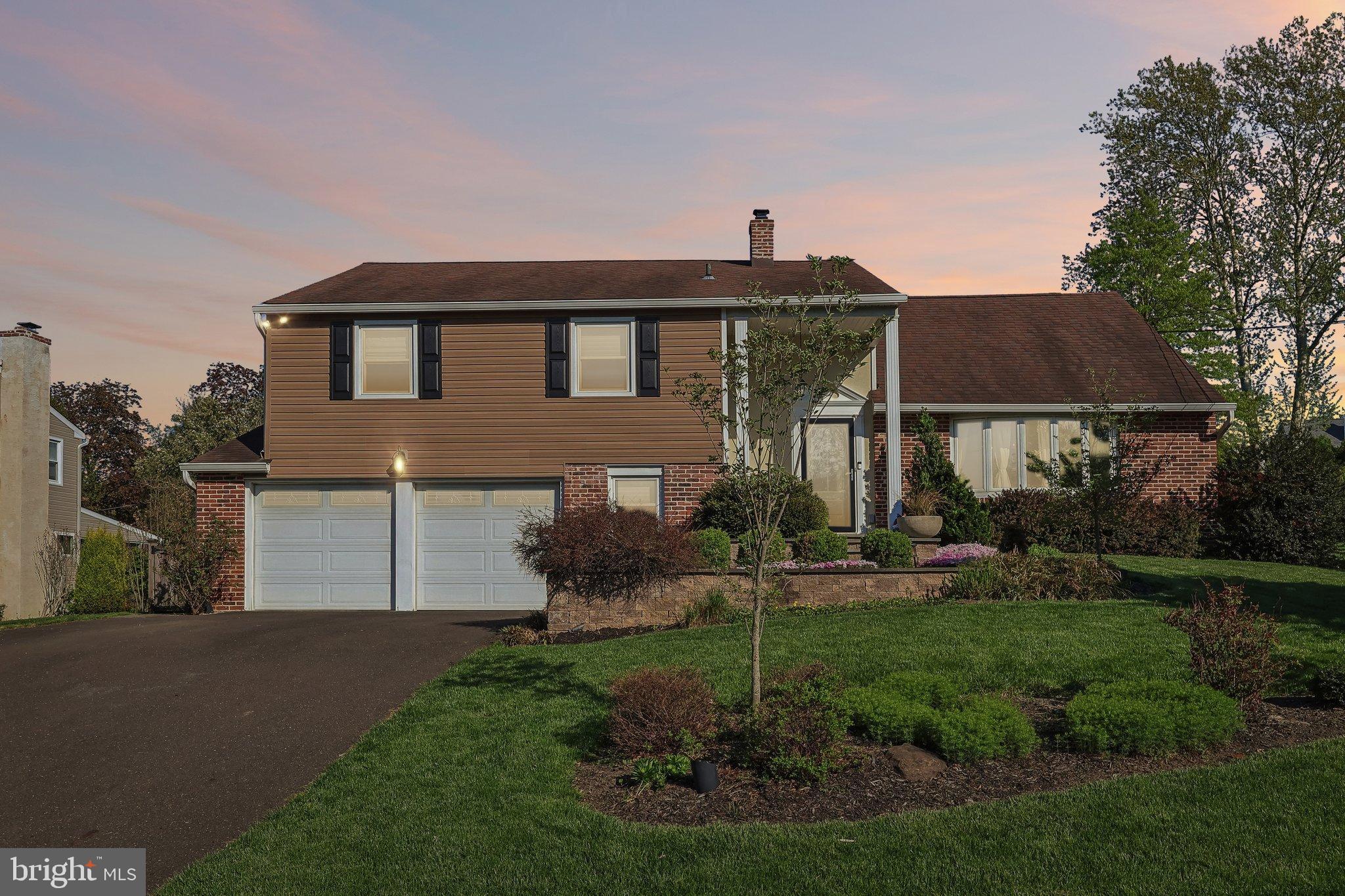 2291 Packard Avenue Huntingdon Valley, PA 19006 - Photo 37 of 38 a front view of a house with garden
