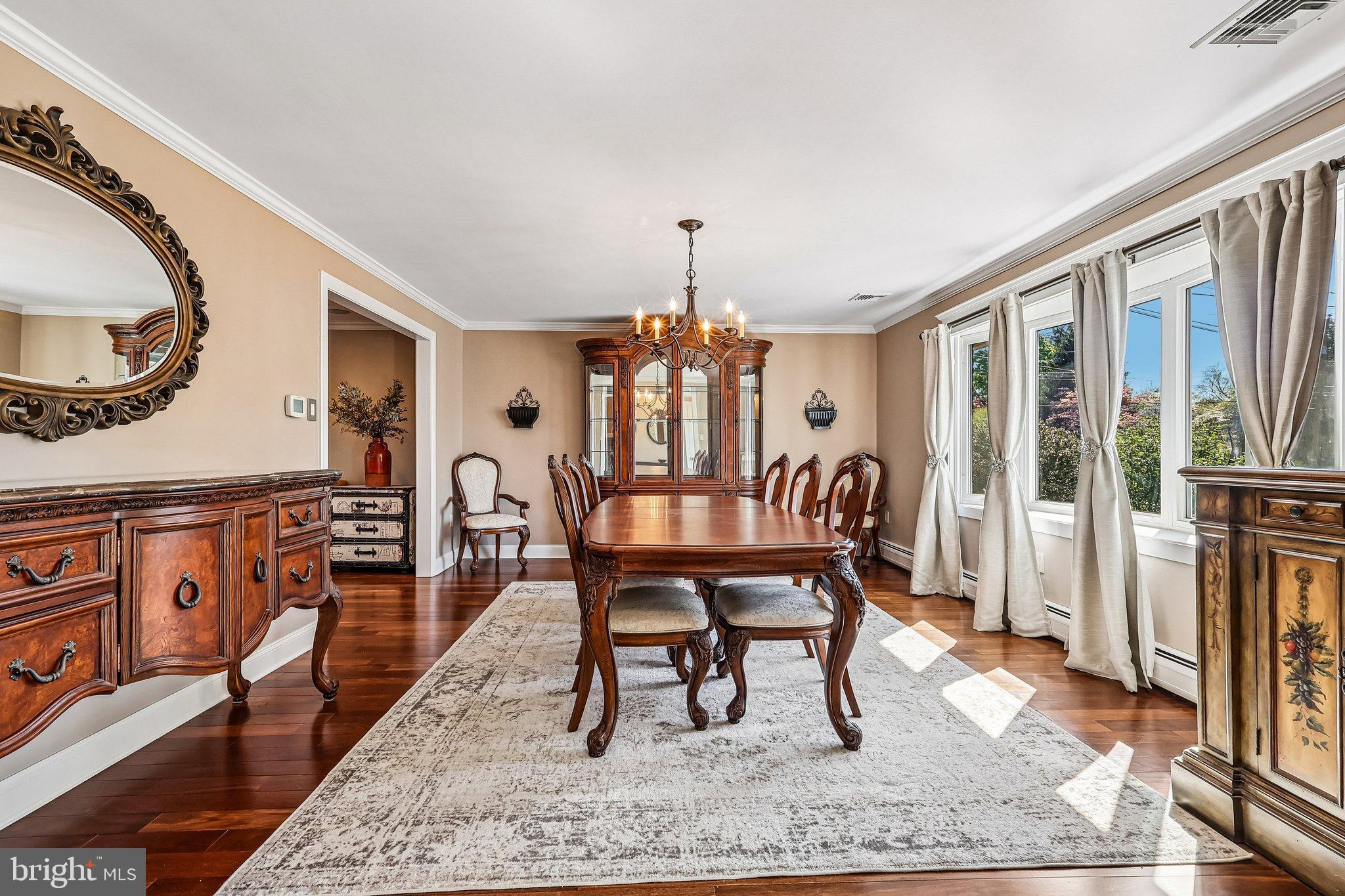 2291 Packard Avenue Huntingdon Valley, PA 19006 - Photo 4 of 38 a dining room with furniture a rug and a chandelier