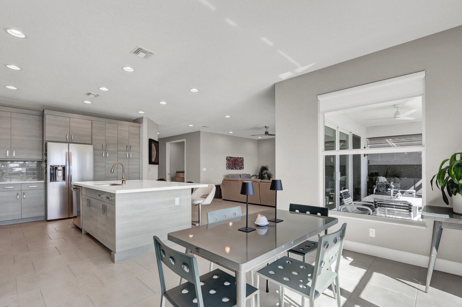 13246 Southwest Blue River Road Port St. Lucie, FL 34987 - Photo 17 of 61 Dining room into kitchen