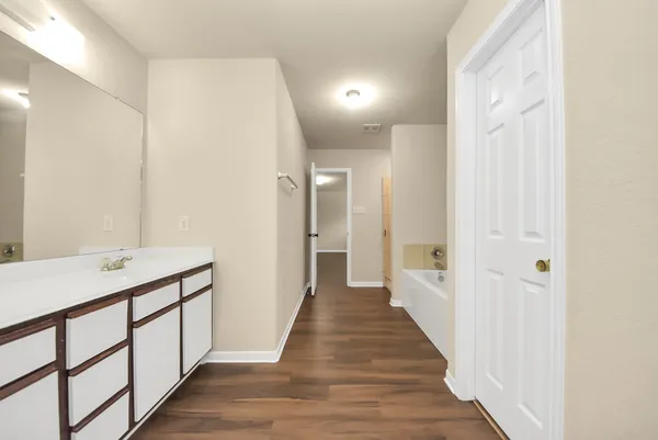 a hallway with wooden floor