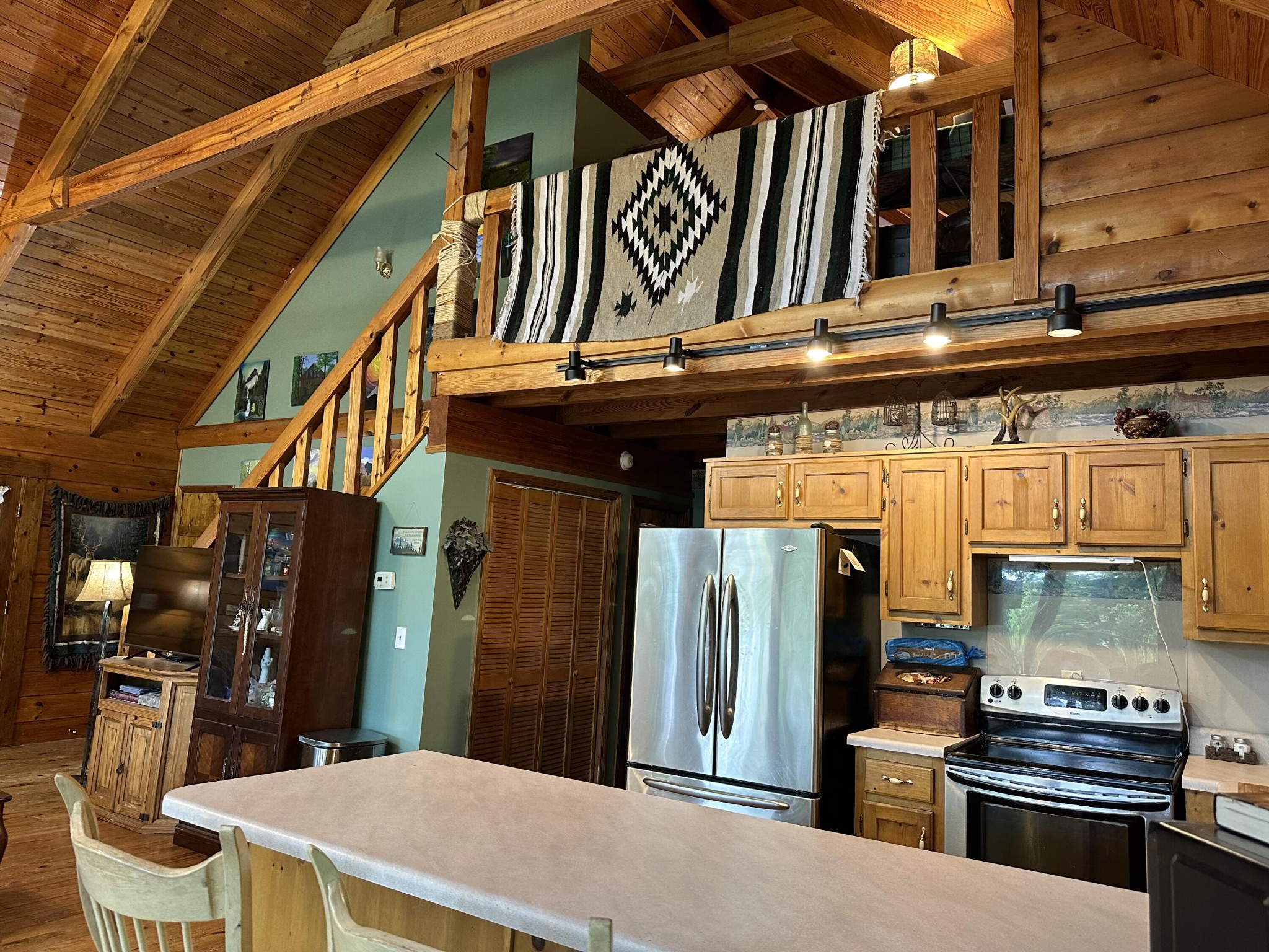 606 Morgan Road Charleston, TN 37310 - Photo 29 of 53 a kitchen with a refrigerator and a stove top oven