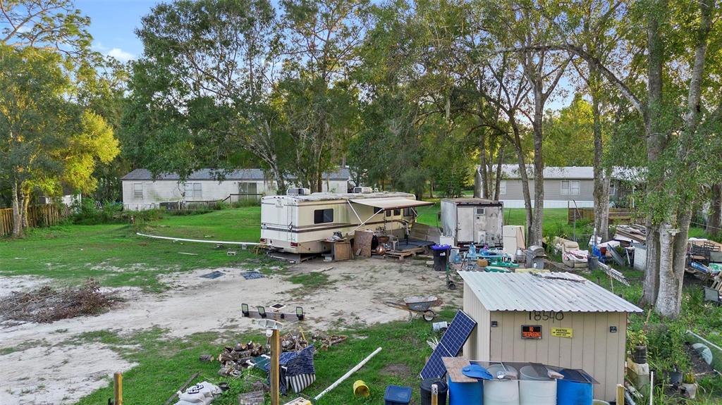 1st Avenue Orlando, FL 32820 - Photo 2 of 6 a view of backyard of house with green space