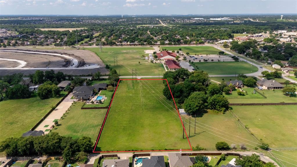1707 Mesquite Valley Road Mesquite, TX 75149 - Photo 2 of 6 an aerial view of a residential houses with outdoor space and lake view