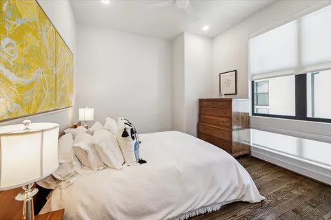 a bedroom with a bed and a dresser