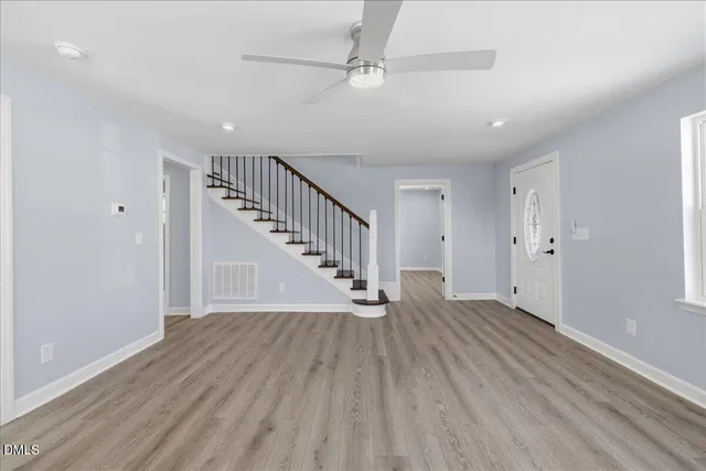 wooden floor in a hall with an entryway