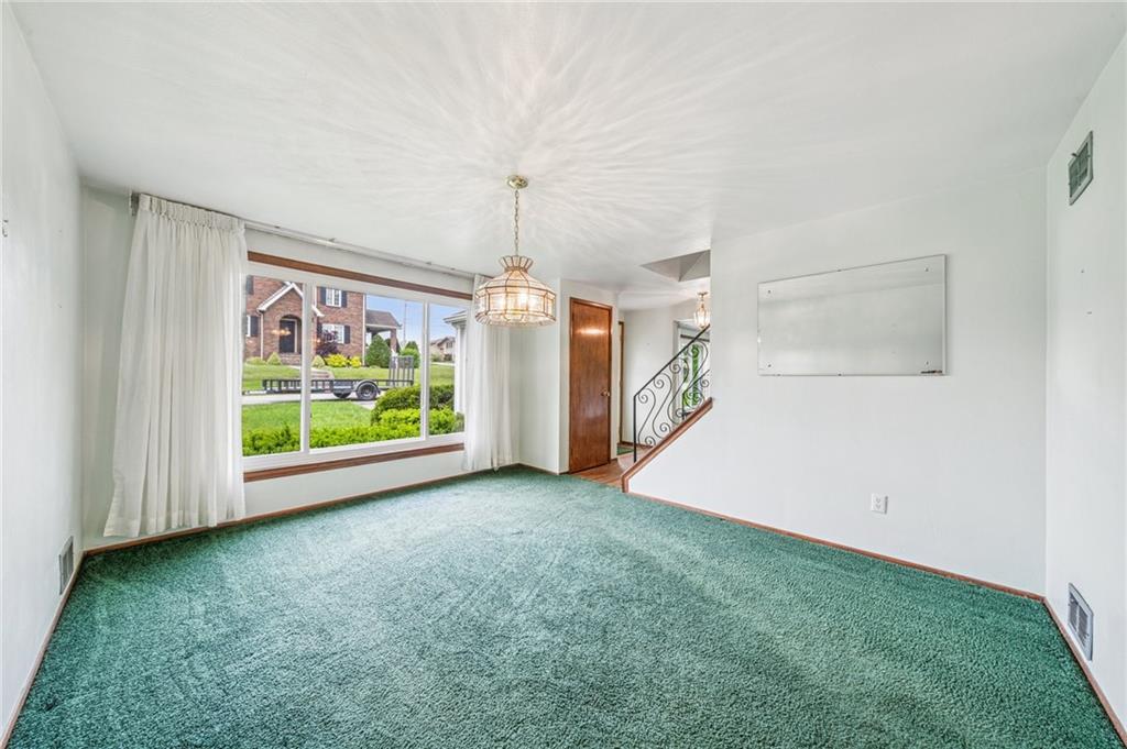 805 Willow Street Irwin, PA 15642 - Photo 12 of 33 an empty room with windows and outdoor view