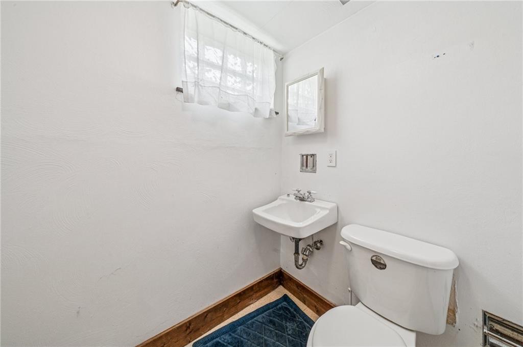 805 Willow Street Irwin, PA 15642 - Photo 27 of 33 a bathroom with a sink toilet and a mirror
