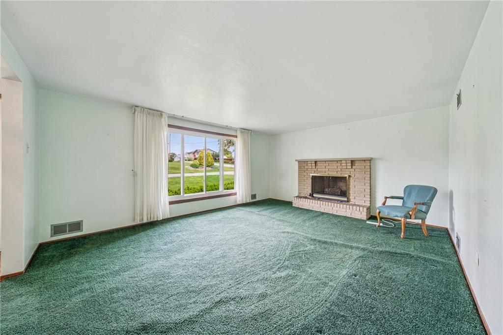 805 Willow Street Irwin, PA 15642 - Photo 5 of 33 a view of empty room with fireplace and window