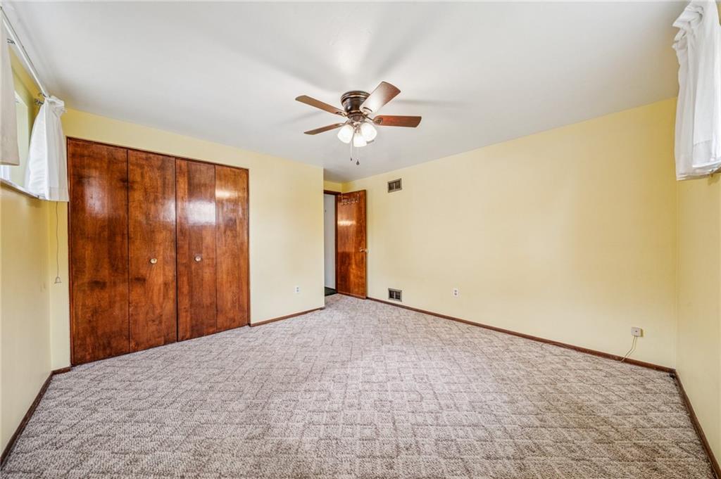 805 Willow Street Irwin, PA 15642 - Photo 10 of 33 a view of a livingroom with a ceiling fan and a window