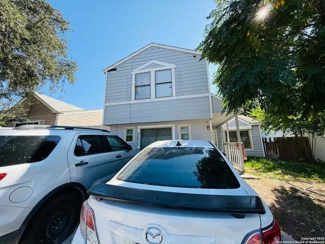 a view of front a house with a sink and yard