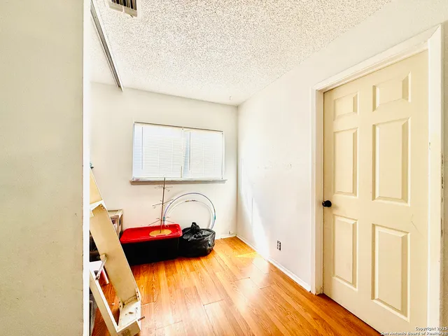 a bedroom with a bed and a closet