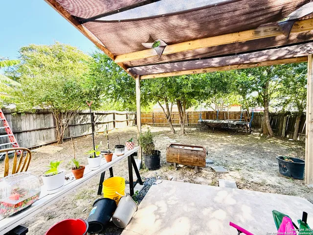 a view of yard with patio