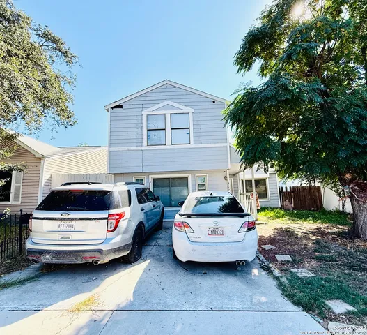 a car parked in front of a house