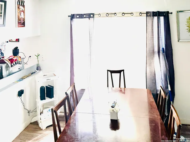 a view of kitchen with furniture and wooden floor