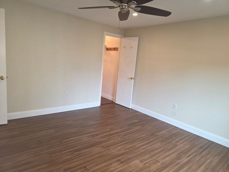 70 Mudge Street, Unit 12 Lynn, MA 01902 - Photo 14 of 22 a view of an empty room with wooden floor