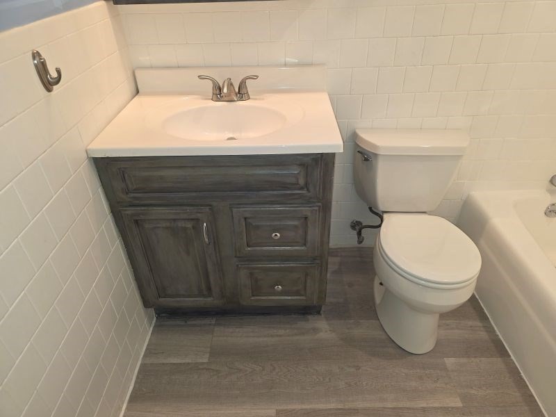 70 Mudge Street, Unit 12 Lynn, MA 01902 - Photo 18 of 22 a bathroom with a sink and a toilet