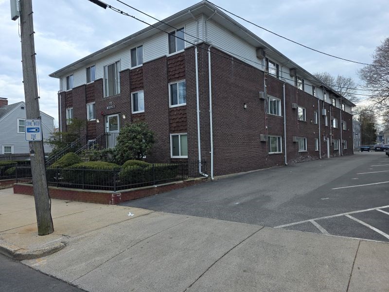 70 Mudge Street, Unit 12 Lynn, MA 01902 - Photo 22 of 22 a front view of a building with garden