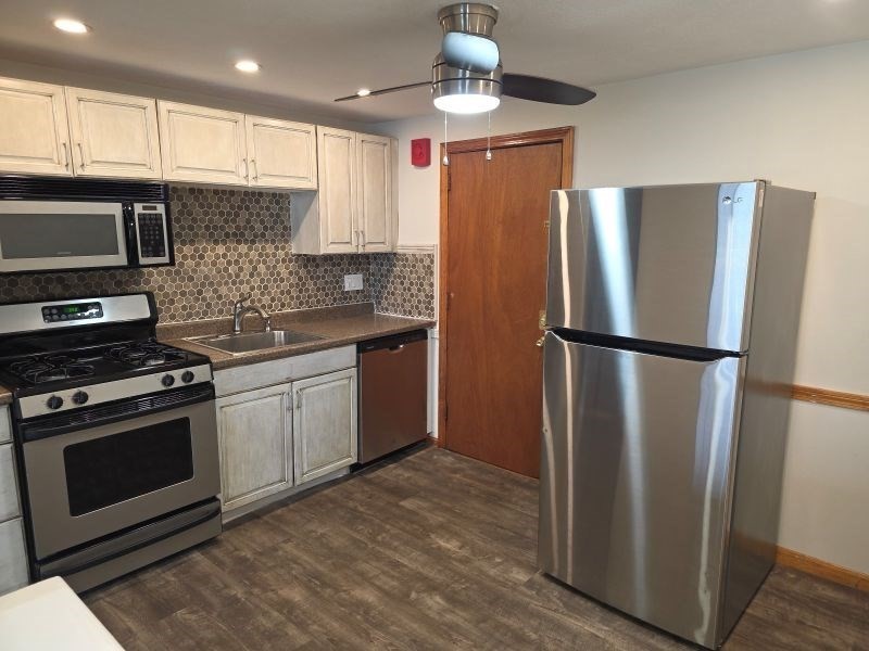 70 Mudge Street, Unit 12 Lynn, MA 01902 - Photo 3 of 22 a kitchen with stainless steel appliances granite countertop a refrigerator a sink and a stove