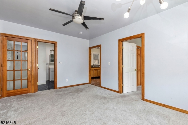 213 Linden Road, Unit 213 Roselle, NJ 07203 - Photo 4 of 14 a view of empty room with ceiling fan