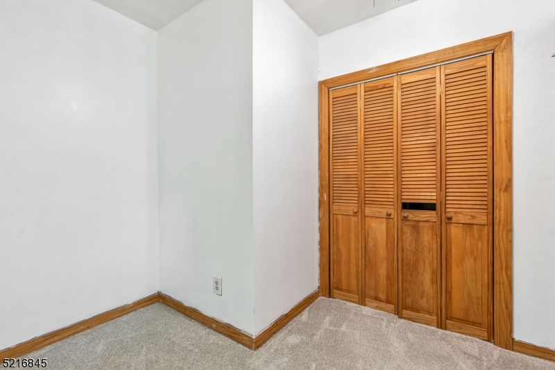 213 Linden Road, Unit 213 Roselle, NJ 07203 - Photo 7 of 14 a view of a room that has a window in it