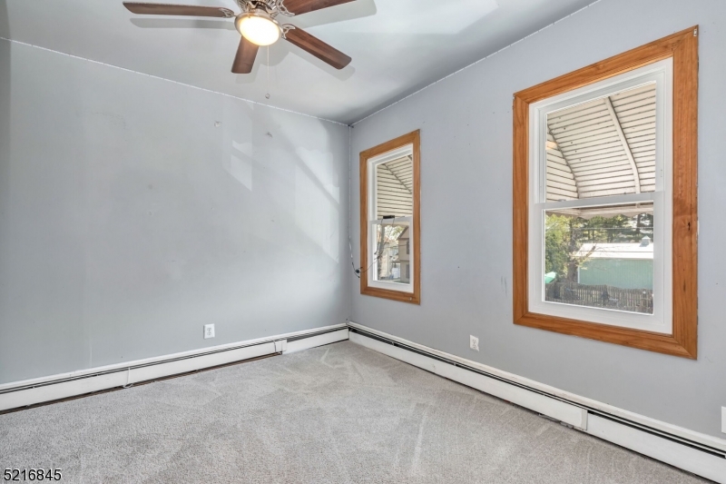 213 Linden Road, Unit 213 Roselle, NJ 07203 - Photo 8 of 14 a view of an empty room with a window