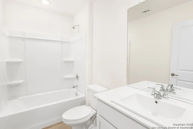 a bathroom with a sink toilet and a bathtub