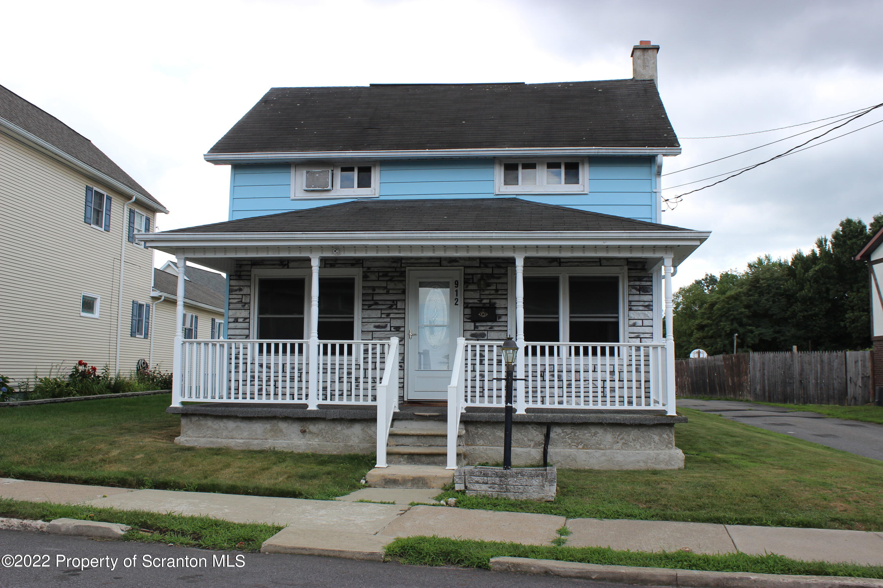 912 Spring Street Moosic, PA 18507 - Photo 1 of 24 a front view of a house with a yard