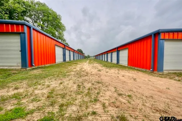 a view of outdoor space with swimming pool and green space