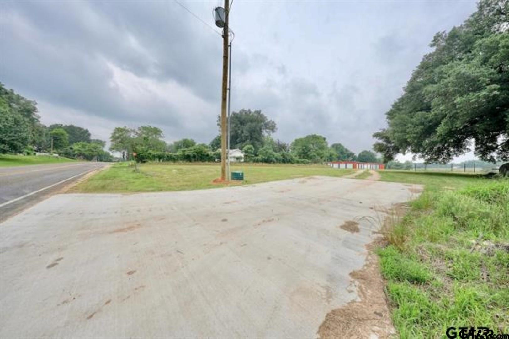 805 Dallas Street Winona, TX 75792 - Photo 10 of 20 a view of a playground with a road sign