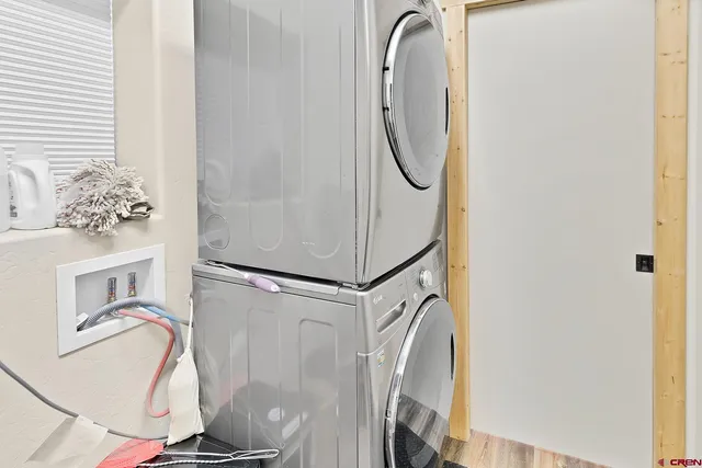 a bathroom with a granite countertop sink a mirror and a shower