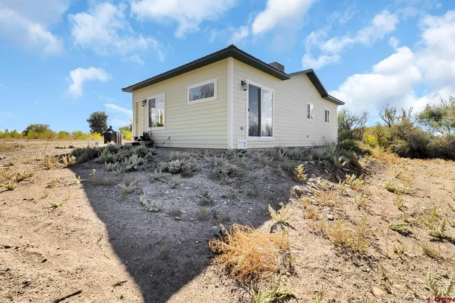 a view of a backyard of the house