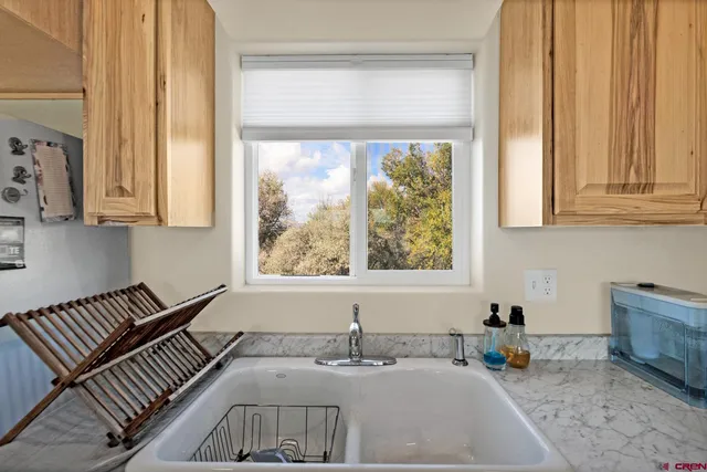 a bathroom with a sink and a window