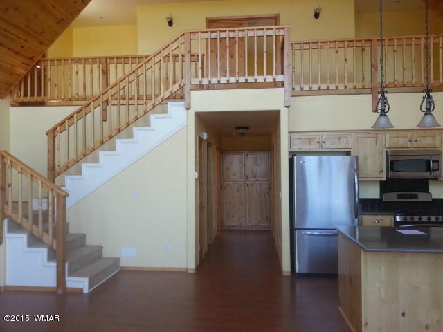 3238 Lodgepole Road Overgaard, AZ 85933 - Photo 2 of 7 a view of entryway and kitchen with microwave