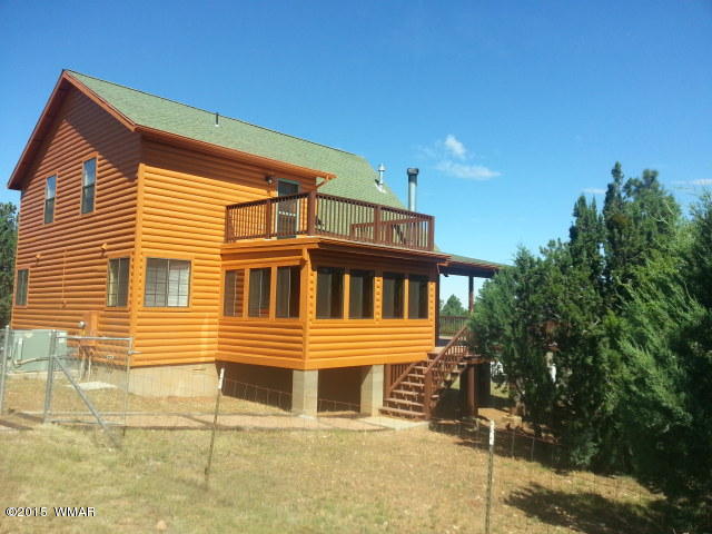3238 Lodgepole Road Overgaard, AZ 85933 - Photo 4 of 7 a front view of a house