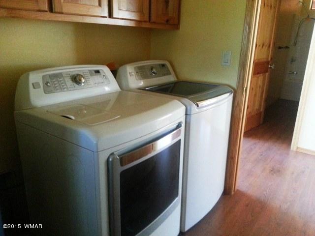 3238 Lodgepole Road Overgaard, AZ 85933 - Photo 7 of 7 a utility room with dryer and washer