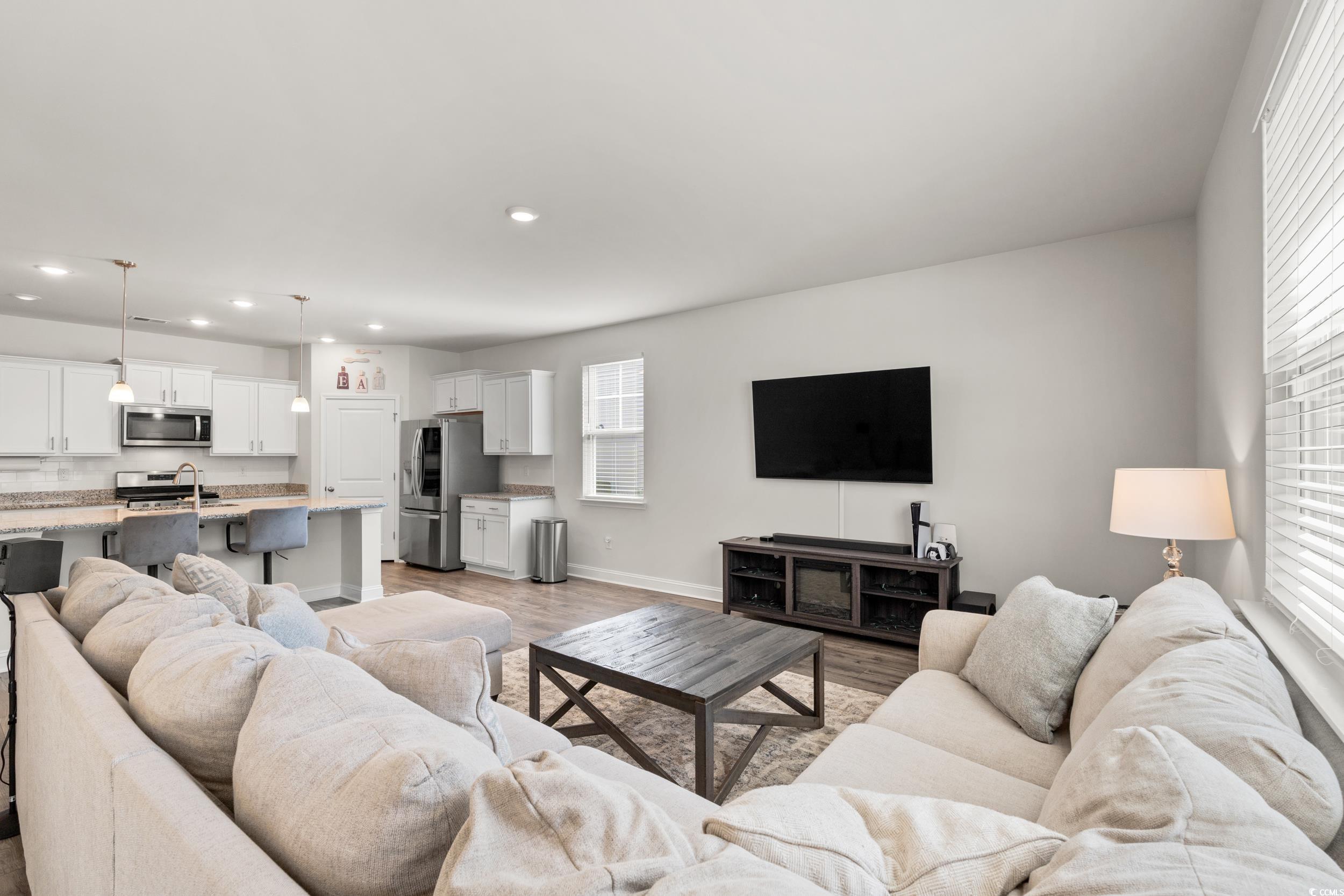 1087 Baker Creek Loop Myrtle Beach, SC 29579 - Photo 11 of 37 Living area featuring light wood-type flooring, re