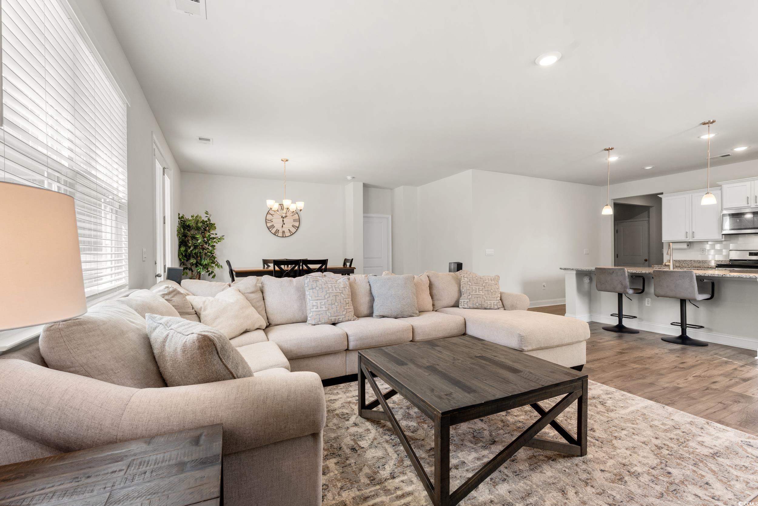 1087 Baker Creek Loop Myrtle Beach, SC 29579 - Photo 12 of 37 Living room featuring a chandelier, recessed light