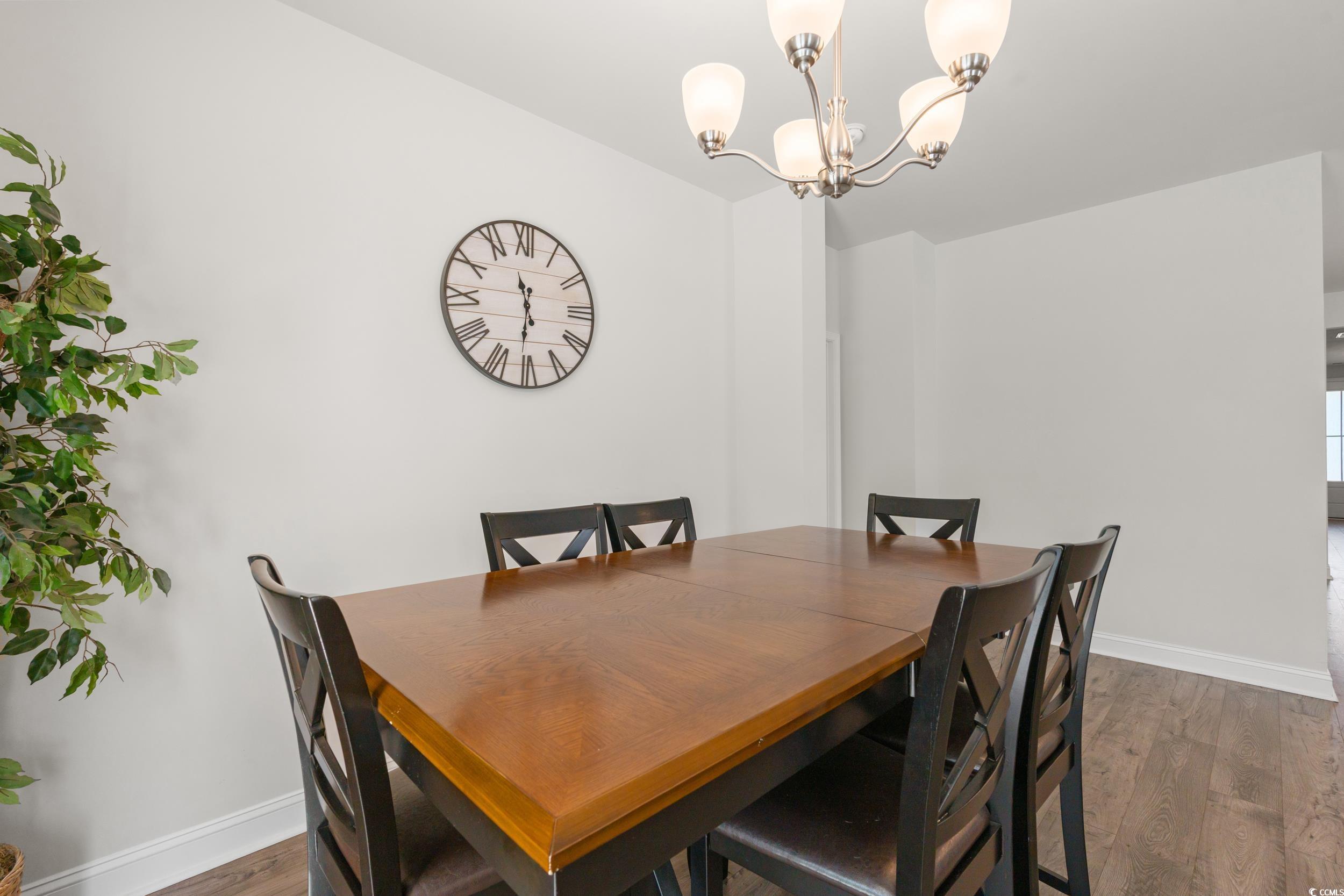 1087 Baker Creek Loop Myrtle Beach, SC 29579 - Photo 13 of 37 Dining area featuring dark wood-type flooring, a n