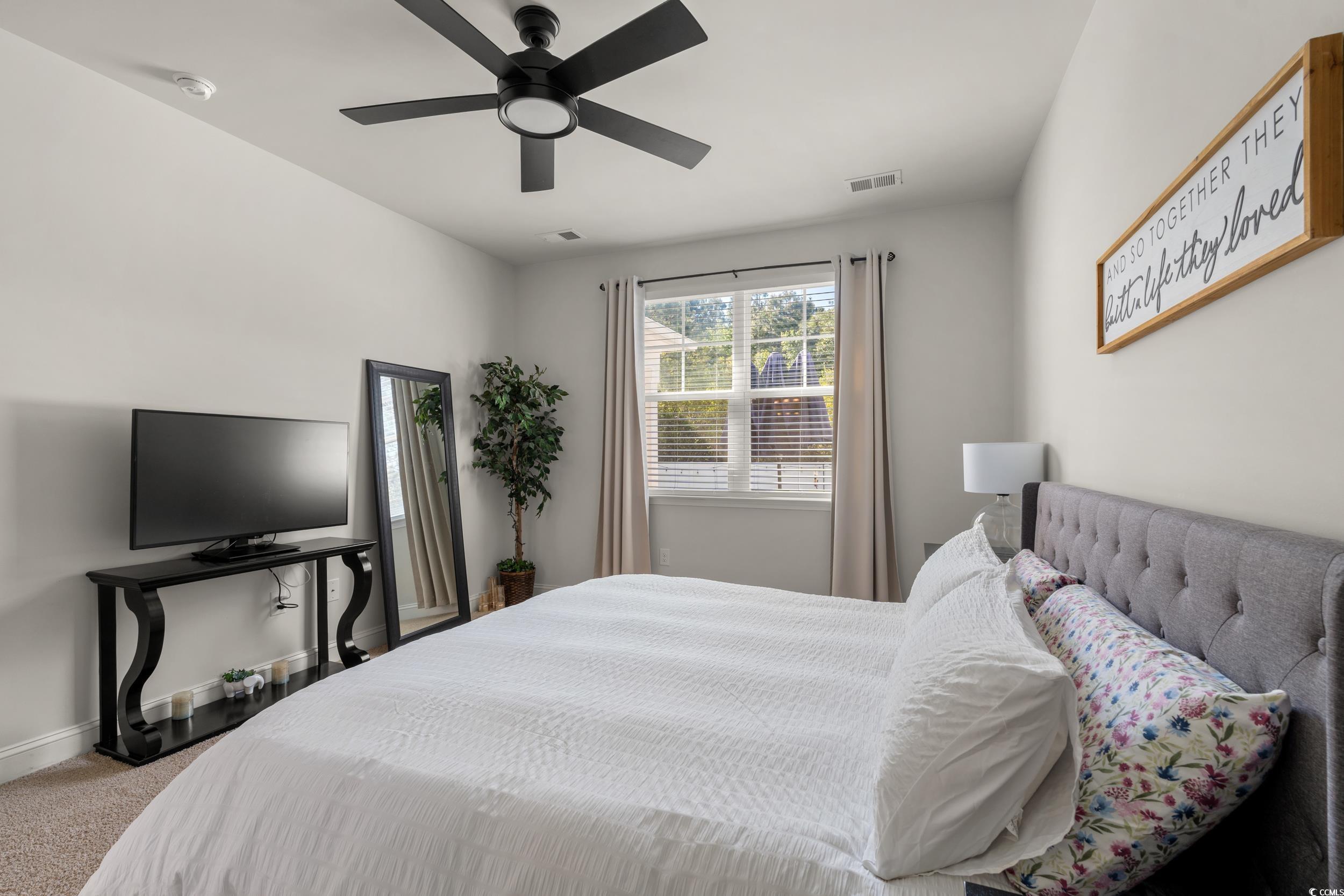 1087 Baker Creek Loop Myrtle Beach, SC 29579 - Photo 19 of 37 Carpeted bedroom with visible vents, a ceiling fan