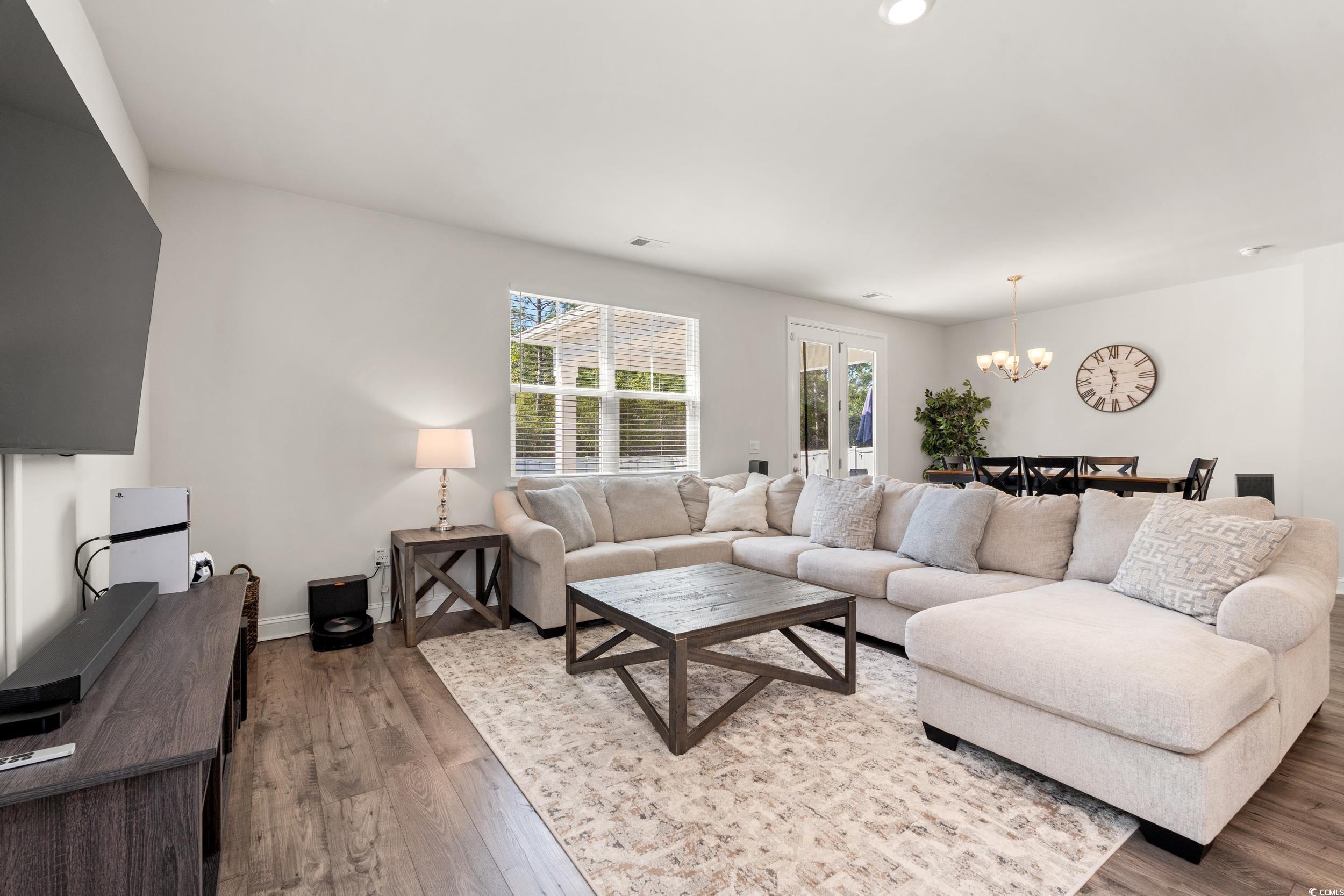 1087 Baker Creek Loop Myrtle Beach, SC 29579 - Photo 2 of 37 Living room featuring visible vents, an inviting c