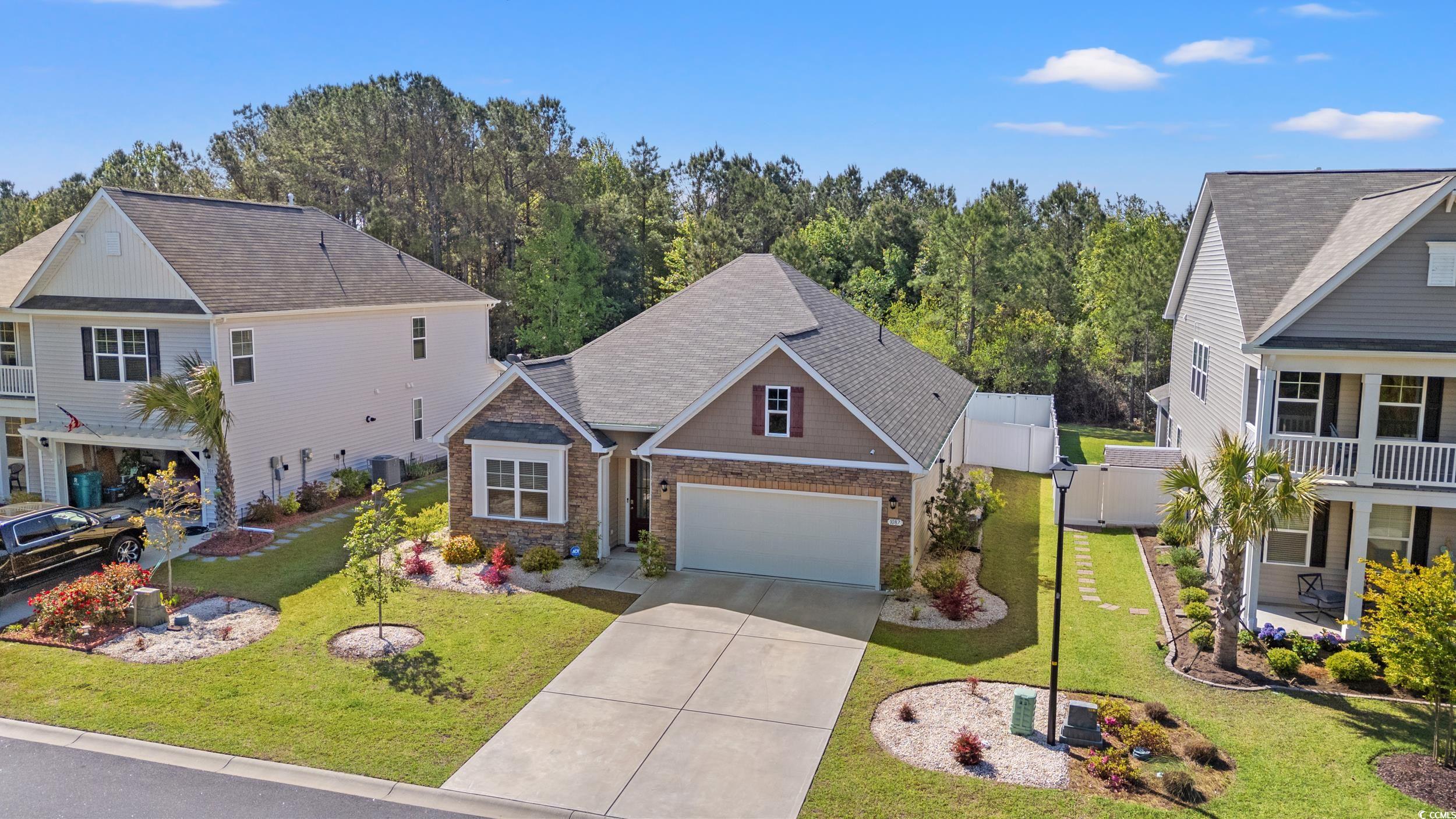 1087 Baker Creek Loop Myrtle Beach, SC 29579 - Photo 29 of 37 Traditional home with central air condition unit,