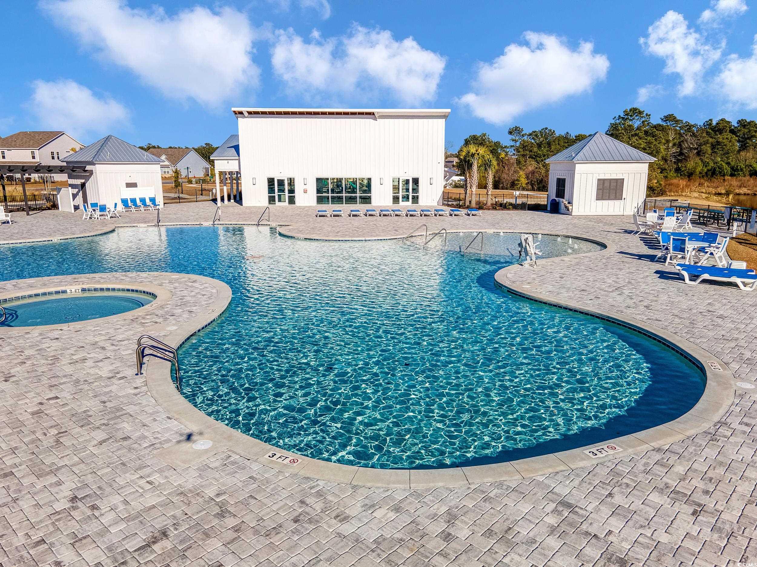 1087 Baker Creek Loop Myrtle Beach, SC 29579 - Photo 34 of 37 Community pool featuring an outbuilding, a communi