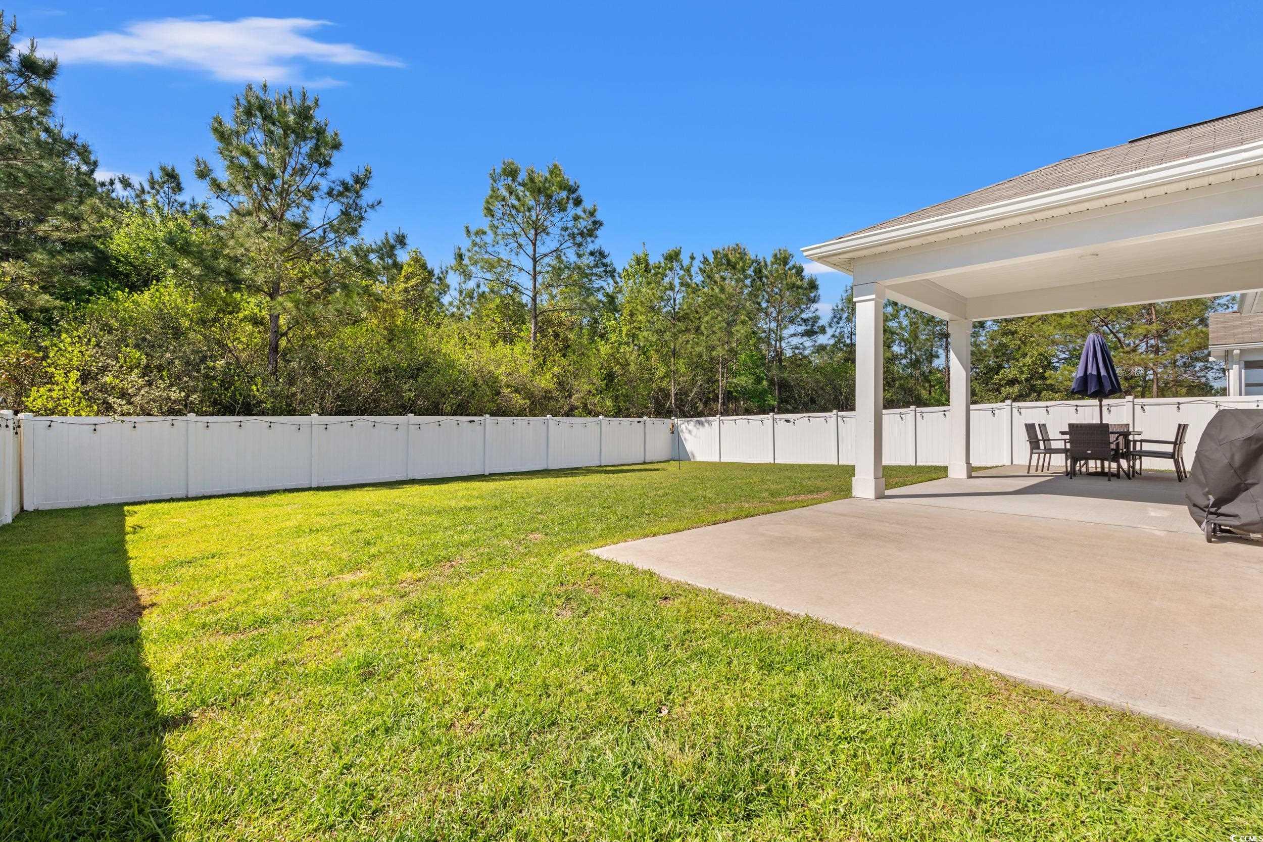 1087 Baker Creek Loop Myrtle Beach, SC 29579 - Photo 5 of 37 View of yard with a patio and a fenced backyard
