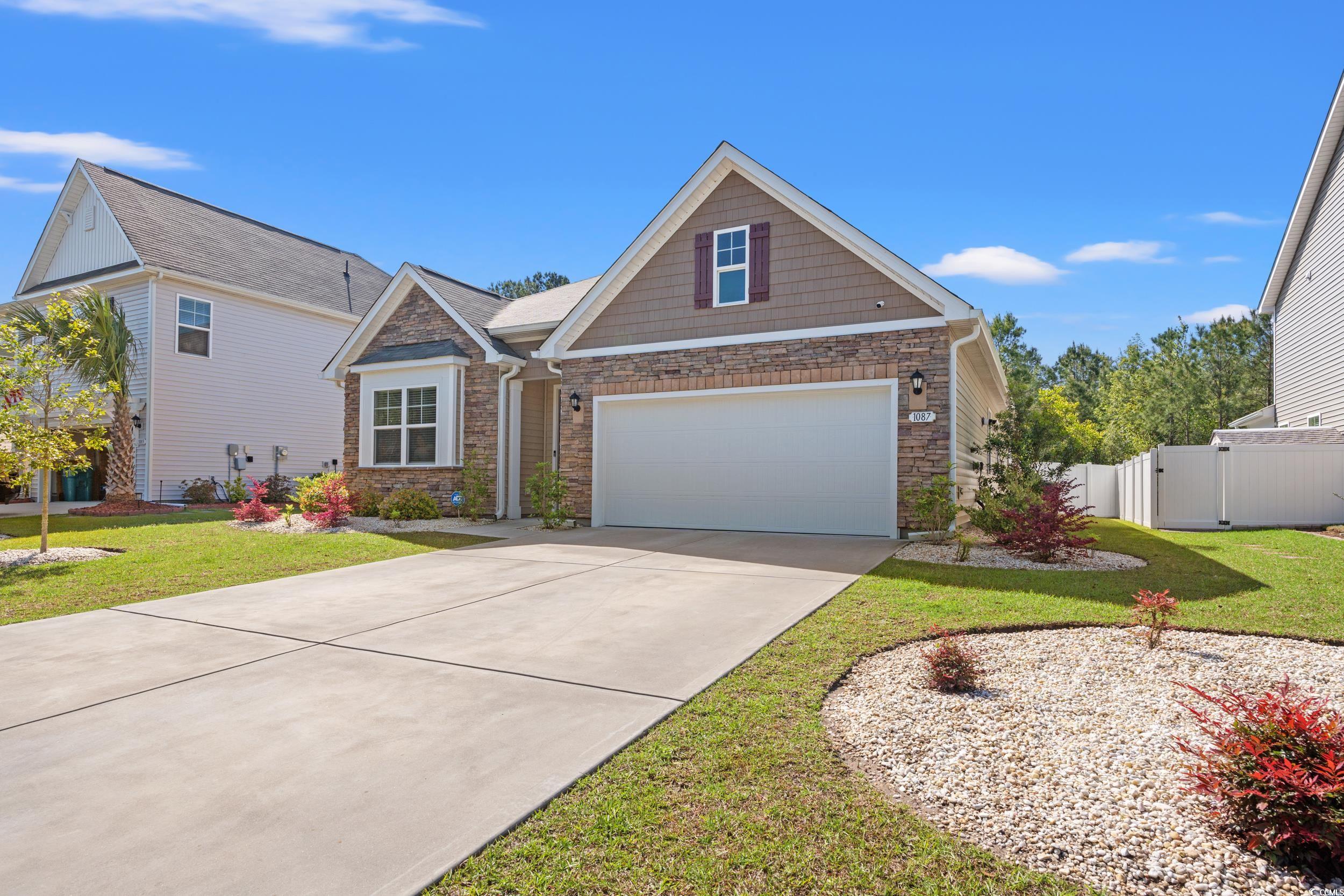 1087 Baker Creek Loop Myrtle Beach, SC 29579 - Photo 7 of 37 Traditional-style home with a front yard, a garage