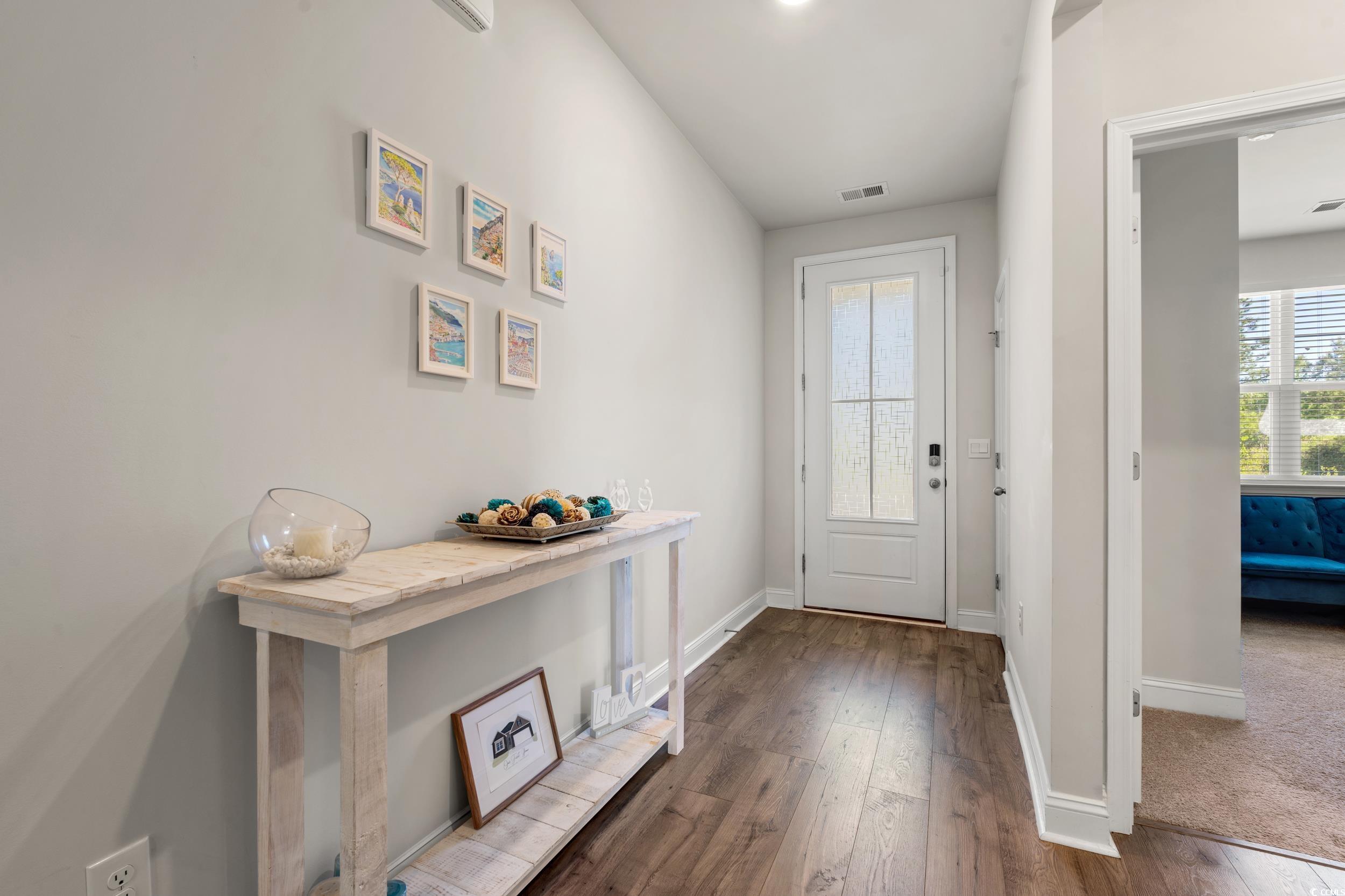 1087 Baker Creek Loop Myrtle Beach, SC 29579 - Photo 9 of 37 Doorway to outside featuring baseboards, visible v